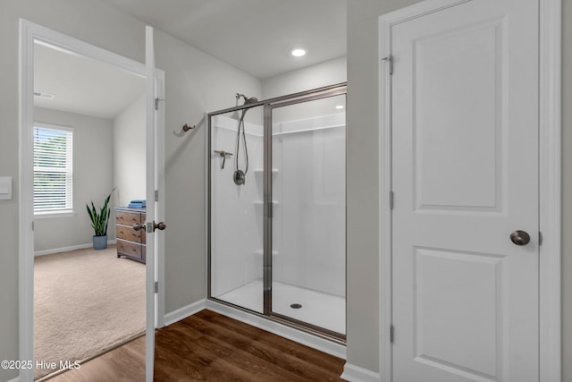 6751 Blacktip Ln, Wilmington, NC 28412 - full bathroom with a shower stall and wood finished floors