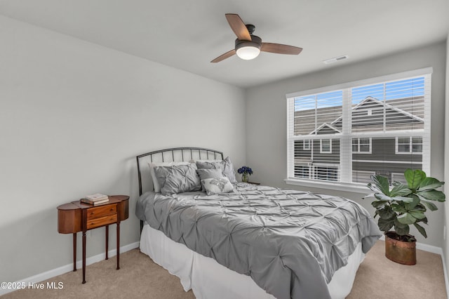 6751 Blacktip Ln, Wilmington, NC 28412 - carpeted bedroom featuring baseboards and ceiling fan