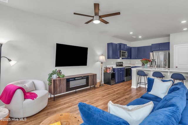 6751 Blacktip Ln, Wilmington, NC 28412 - living room featuring ceiling fan, light wood finished floors, and recessed lighting