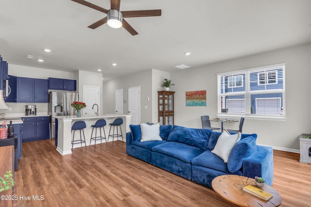 6751 Blacktip Ln, Wilmington, NC 28412 - living area with a ceiling fan, recessed lighting, and light wood-style flooring