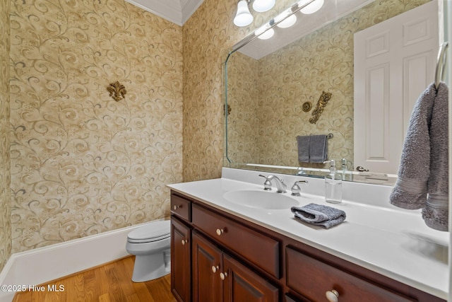 30 Spring Valley Ct, Pinehurst, NC 28374 - bathroom featuring wood finished floors, vanity, wallpapered walls, and ornamental molding