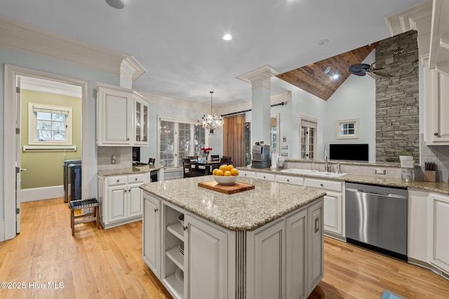 30 Spring Valley Ct, Pinehurst, NC 28374 - kitchen featuring stainless steel dishwasher, a center island, healthy amount of natural light, white cabinetry, and vaulted ceiling