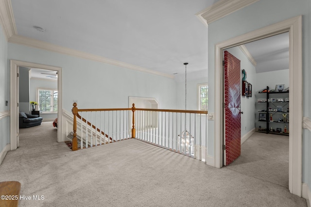 30 Spring Valley Ct, Pinehurst, NC 28374 - hall featuring carpet floors, ornamental molding, healthy amount of natural light, and an upstairs landing