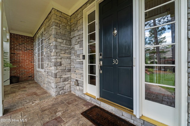 30 Spring Valley Ct, Pinehurst, NC 28374 - property entrance with covered porch and brick siding
