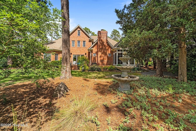 30 Spring Valley Ct, Pinehurst, NC 28374 - view of front of property featuring a chimney and brick siding