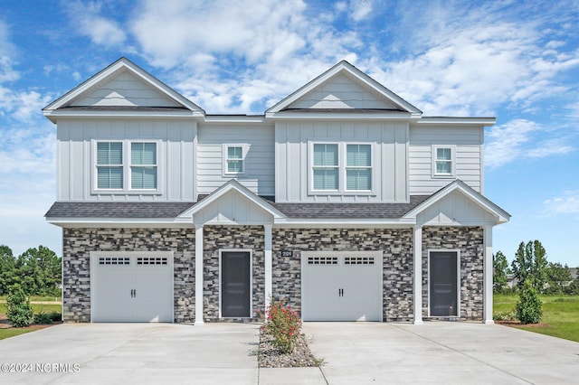 2125 Kali Ln Unit A, Greenville, NC 27834 - view of front facade featuring board and batten siding, a garage, and driveway