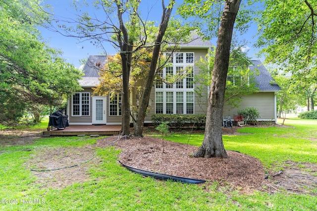 1505 Faulkenberry Rd, Wilmington, NC 28409 - back of property with a wooden deck, a yard, and roof with shingles