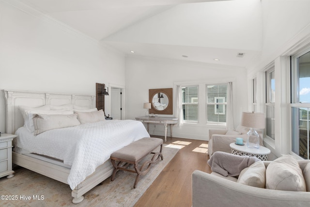 585 Forest Dunes Dr, Pine Knoll Shores, NC 28512 - bedroom featuring light wood finished floors, recessed lighting, high vaulted ceiling, and ornamental molding