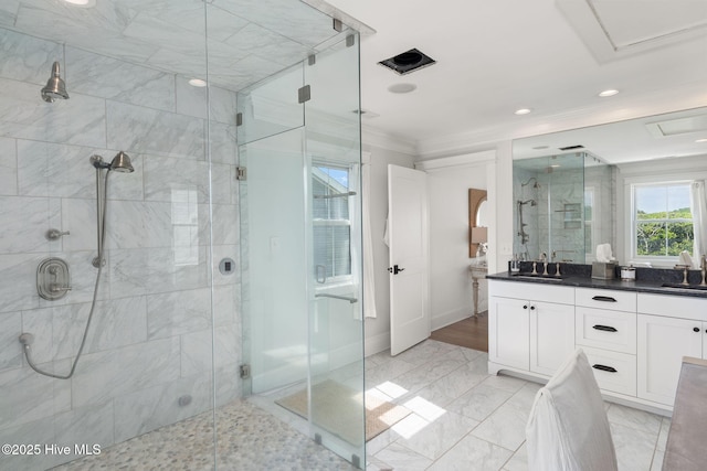 585 Forest Dunes Dr, Pine Knoll Shores, NC 28512 - full bathroom with a shower stall, double vanity, ornamental molding, recessed lighting, and marble finish floors