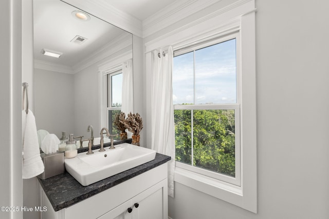 585 Forest Dunes Dr, Pine Knoll Shores, NC 28512 - bathroom with crown molding, vanity, and healthy amount of natural light