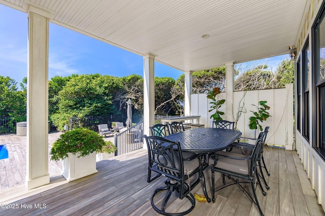 585 Forest Dunes Dr, Pine Knoll Shores, NC 28512 - wooden deck with outdoor dining space