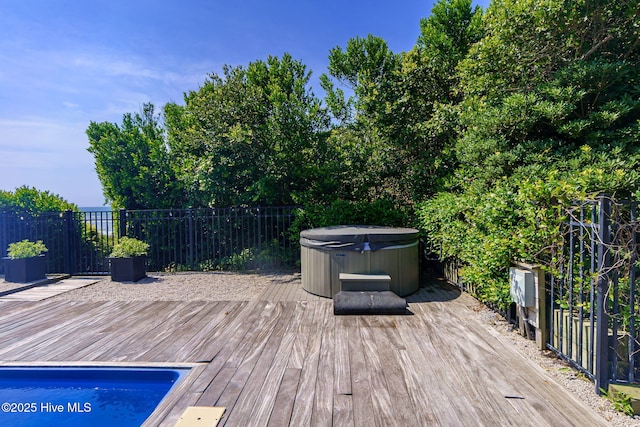 585 Forest Dunes Dr, Pine Knoll Shores, NC 28512 - wooden deck with a hot tub