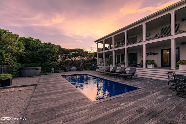 585 Forest Dunes Dr, Pine Knoll Shores, NC 28512 - swimming pool featuring a patio, a covered hot tub, and a wooden deck