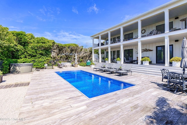 585 Forest Dunes Dr, Pine Knoll Shores, NC 28512 - swimming pool with a hot tub and a patio