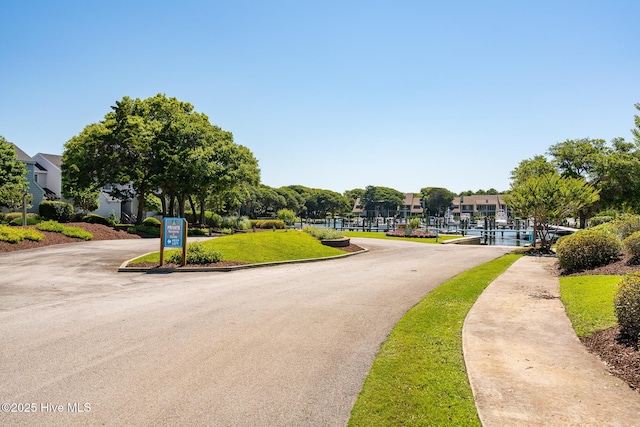 585 Forest Dunes Dr, Pine Knoll Shores, NC 28512 - view of asphalt street featuring a residential view and sidewalks