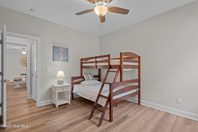 163 NE 31st St, Oak Island, NC 28465 - bedroom with light wood-type flooring, baseboards, and ceiling fan