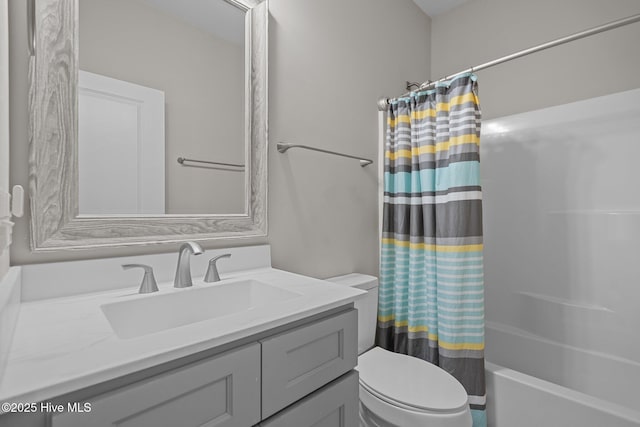 163 NE 31st St, Oak Island, NC 28465 - full bath featuring vanity, shower / bath combo with shower curtain, and toilet