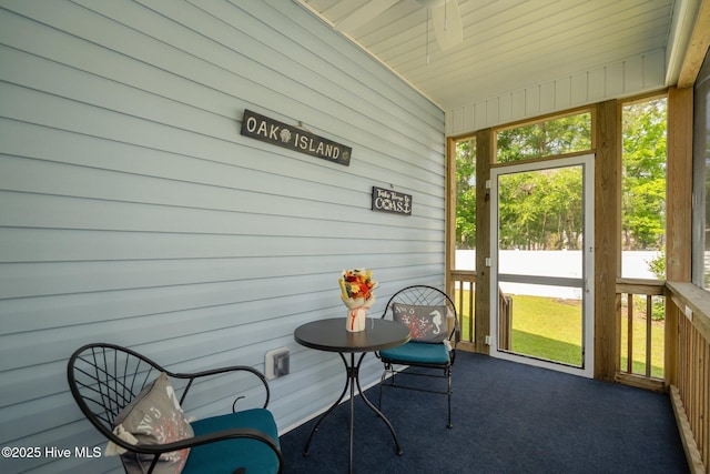 163 NE 31st St, Oak Island, NC 28465 - sunroom featuring ceiling fan