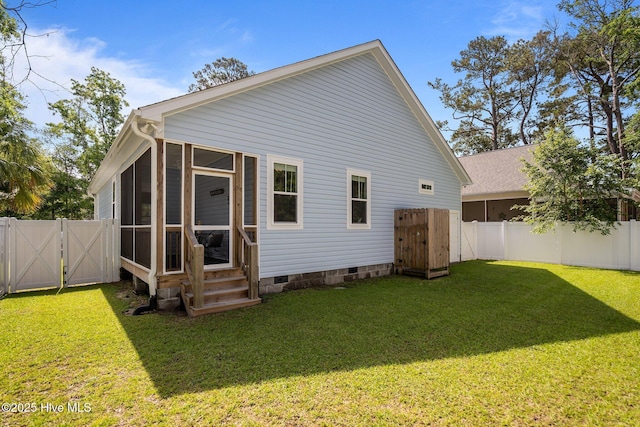 163 NE 31st St, Oak Island, NC 28465 - rear view of property featuring a gate, crawl space, a sunroom, and entry steps