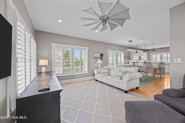 102 Seaside Ln, North Topsail Beach, NC 28460 - living room featuring light wood finished floors and recessed lighting