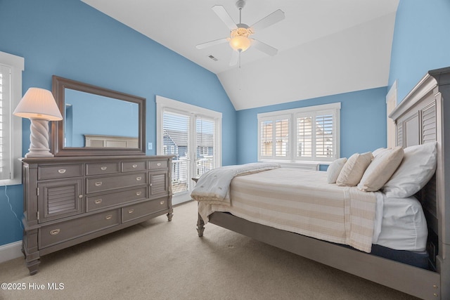 102 Seaside Ln, North Topsail Beach, NC 28460 - bedroom featuring vaulted ceiling, light carpet, and a ceiling fan