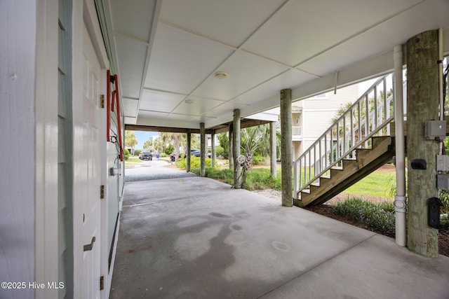102 Seaside Ln, North Topsail Beach, NC 28460 - view of patio / terrace with stairway and a carport