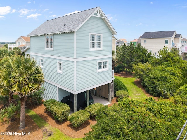 102 Seaside Ln, North Topsail Beach, NC 28460 - view of property exterior with a shingled roof