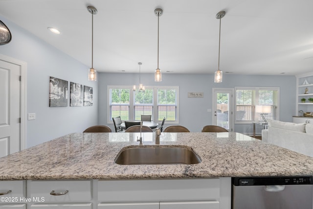 74 W Weatherbee Way, Hampstead, NC 28443 - kitchen featuring stainless steel dishwasher, open floor plan, a sink, plenty of natural light, and recessed lighting