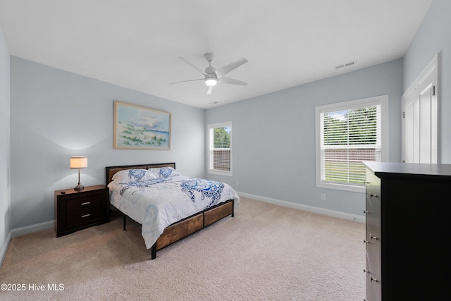 74 W Weatherbee Way, Hampstead, NC 28443 - bedroom featuring baseboards, light carpet, and a ceiling fan