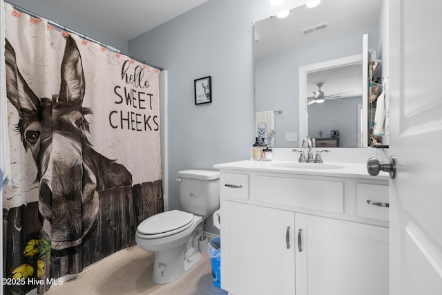 74 W Weatherbee Way, Hampstead, NC 28443 - full bathroom featuring vanity, toilet, ceiling fan, tile patterned flooring, and curtained shower