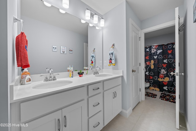 74 W Weatherbee Way, Hampstead, NC 28443 - bathroom featuring double vanity and tile patterned floors