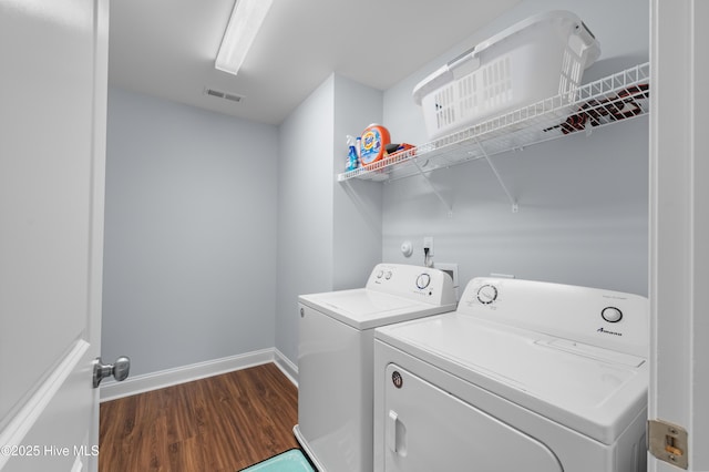 74 W Weatherbee Way, Hampstead, NC 28443 - laundry area featuring independent washer and dryer, dark wood finished floors, and baseboards