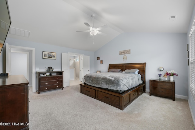 74 W Weatherbee Way, Hampstead, NC 28443 - bedroom with light colored carpet, vaulted ceiling, baseboards, ceiling fan, and connected bathroom