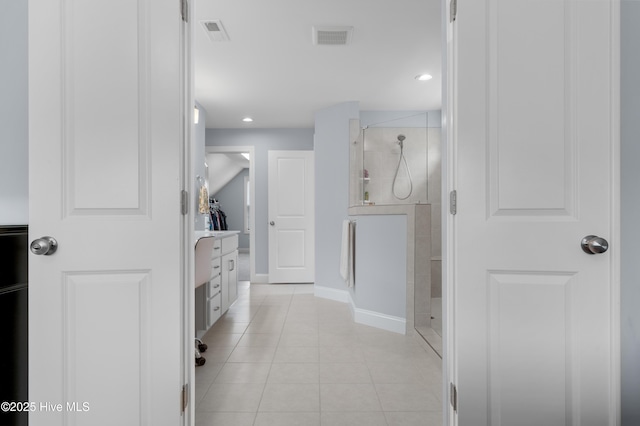 74 W Weatherbee Way, Hampstead, NC 28443 - hall with light tile patterned floors, baseboards, and recessed lighting
