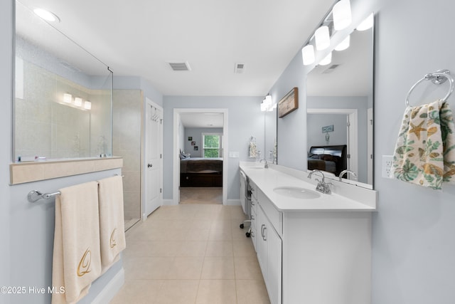 74 W Weatherbee Way, Hampstead, NC 28443 - bathroom featuring ensuite bath, double vanity, walk in shower, tile patterned floors, and baseboards