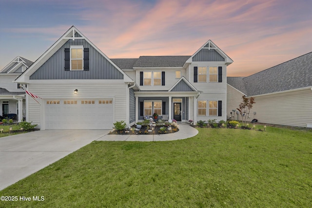 74 W Weatherbee Way, Hampstead, NC 28443 - view of front of property featuring board and batten siding, a front lawn, driveway, and covered porch