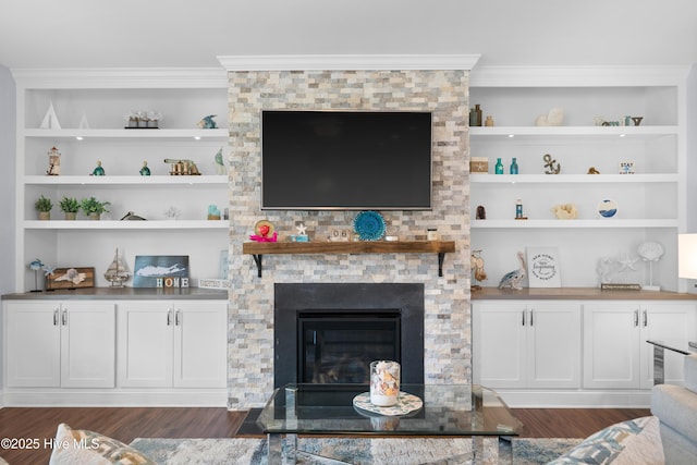 74 W Weatherbee Way, Hampstead, NC 28443 - living area with dark wood finished floors, crown molding, a large fireplace, and built in shelves