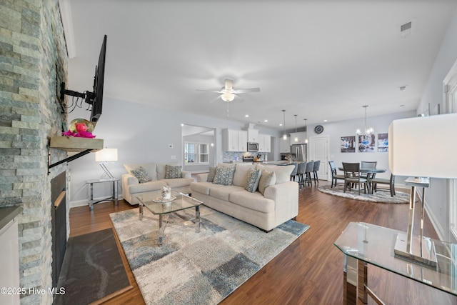 74 W Weatherbee Way, Hampstead, NC 28443 - living room featuring ceiling fan, dark wood-style floors, a fireplace, and baseboards