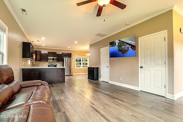 514 Everett Glades, Sneads Ferry, NC 28460 - living room featuring crown molding, ceiling fan, light wood-type flooring, and recessed lighting