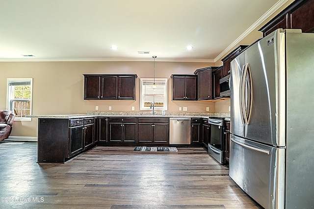 514 Everett Glades, Sneads Ferry, NC 28460 - kitchen with stainless steel appliances, dark wood finished floors, a peninsula, dark brown cabinetry, and ornamental molding