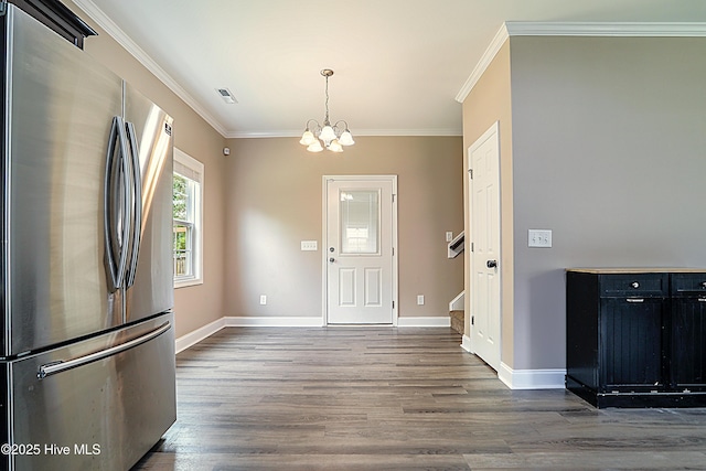 514 Everett Glades, Sneads Ferry, NC 28460 - foyer with a chandelier, ornamental molding, dark wood-style floors, and stairway
