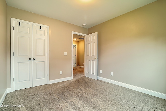 514 Everett Glades, Sneads Ferry, NC 28460 - unfurnished bedroom featuring carpet and a closet
