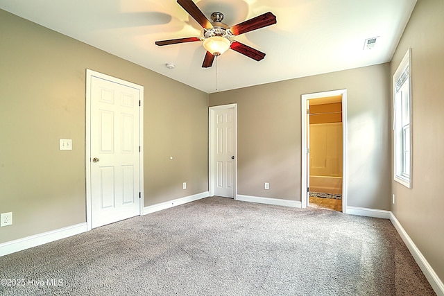 514 Everett Glades, Sneads Ferry, NC 28460 - unfurnished bedroom with multiple windows, carpet, ensuite bath, and ceiling fan