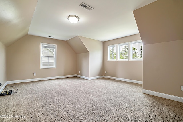 514 Everett Glades, Sneads Ferry, NC 28460 - additional living space featuring light colored carpet, plenty of natural light, and lofted ceiling
