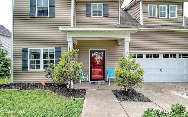 514 Everett Glades, Sneads Ferry, NC 28460 - property entrance featuring a garage, concrete driveway, and a shingled roof