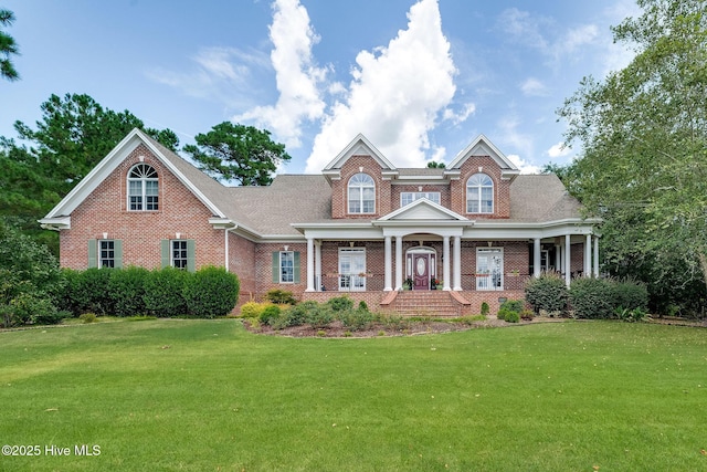 249 Maple Creek Dr, Wallace, NC 28466 - view of front of house with brick siding and a front lawn
