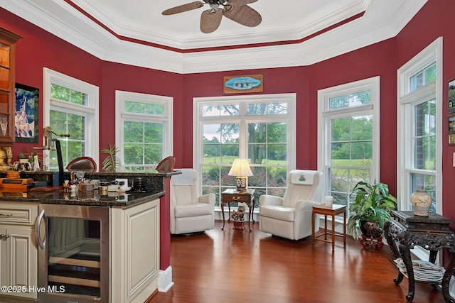 249 Maple Creek Dr, Wallace, NC 28466 - kitchen with wine cooler, crown molding, cream cabinets, dark wood finished floors, and ceiling fan