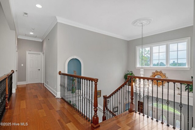 249 Maple Creek Dr, Wallace, NC 28466 - hall with an upstairs landing, ornamental molding, wood finished floors, and recessed lighting