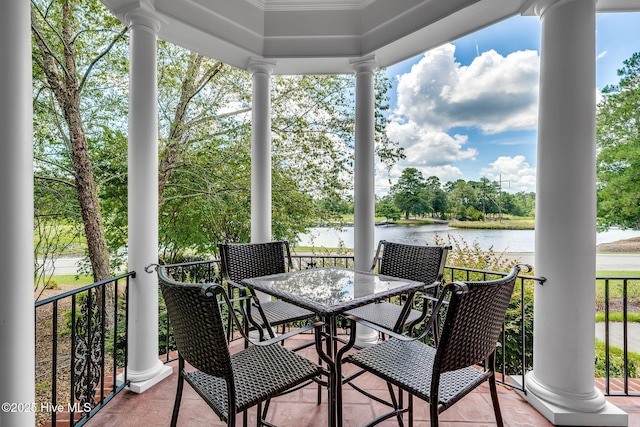 249 Maple Creek Dr, Wallace, NC 28466 - balcony with a water view, outdoor dining area, and view of scattered trees
