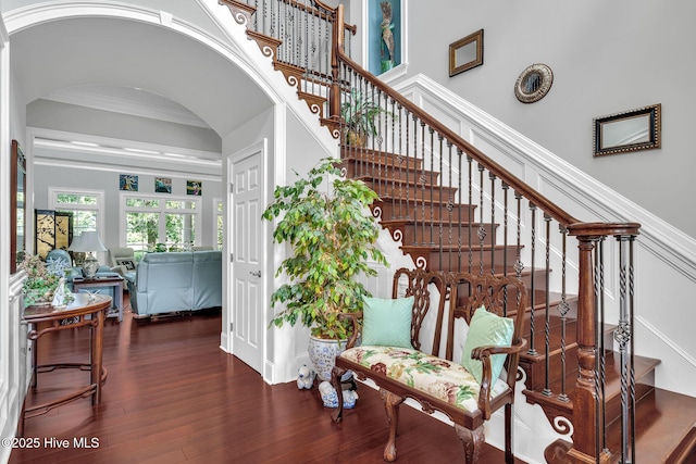 249 Maple Creek Dr, Wallace, NC 28466 - staircase featuring arched walkways and wood finished floors